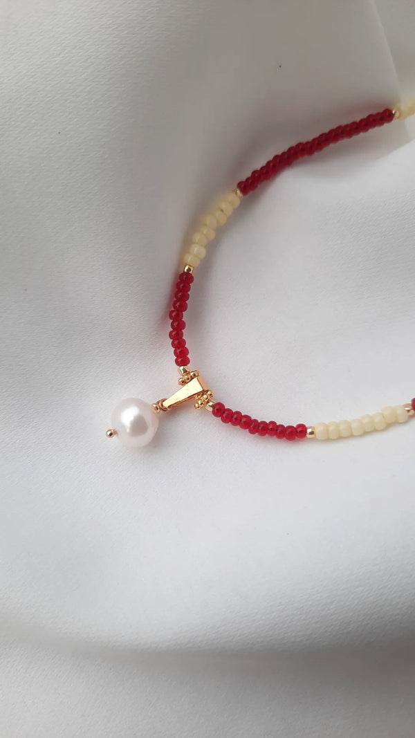 Yellowish Ruby with a pearl